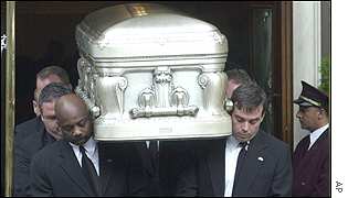 Pallbearers carry the coffin from Frank E Campbell Funeral Home