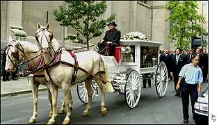 Horse drawn hearse bearing Aaliyah's remains